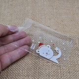 100Pcs Christmas Candy Bags Cute Plastic Gift Cookies Packaging Bags Biscuits Snack Candy Cake Packing Bags for Xmas Decoration