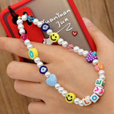 2021 New Colorful Acrylic Pearl Soft Pottery Cartoon Face Fruits Anti-lost Mobile Phone Strap Cord for Women Accessories